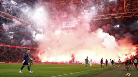 Ajax clash abandoned as huge fireworks display erupts in stands and referee unable to guarantee player safety