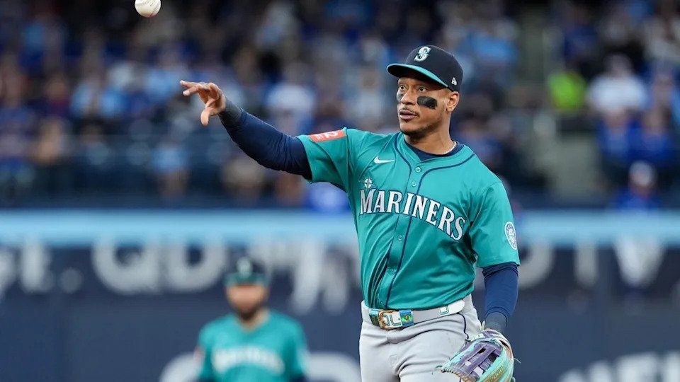 Oct 13, 2025; Toronto, Ontario, CAN; Seattle Mariners infielder Jorge Polanco (7) throws to first base for the first out in the third inning against the Toronto Blue Jays during game two of the ALCS round for the 2025 MLB playoffs at Rogers Centre.