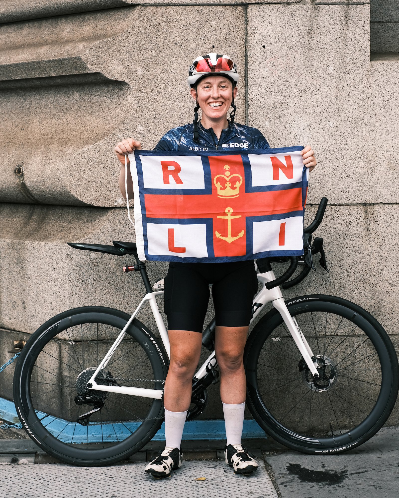 Molly weaver holds RNLI flag