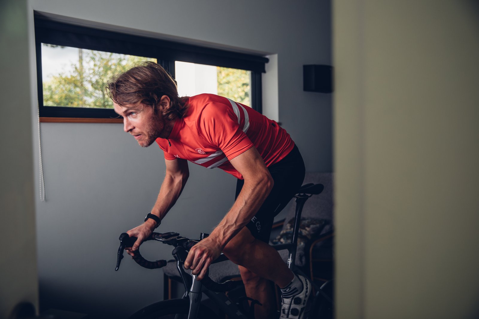 A man rides on an indoor trainer