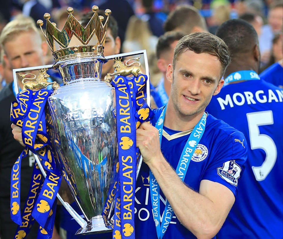 Andy King holding up the Barclays Premier League trophy.
