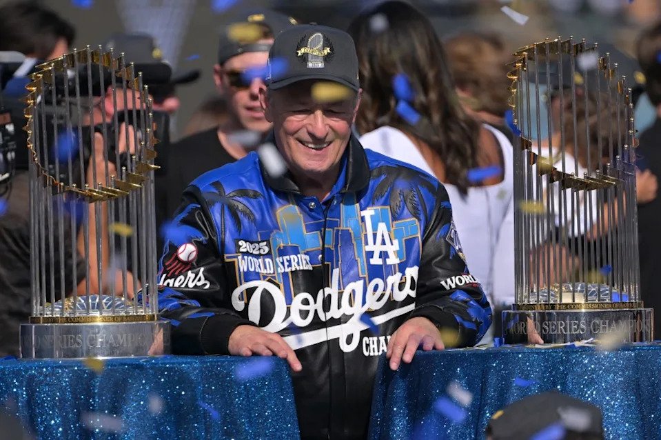 Dodgers’ president Stan Kasten stands in between the 2025 and 2026 World Series Trophies. IMAGN IMAGES via Reuters Connect