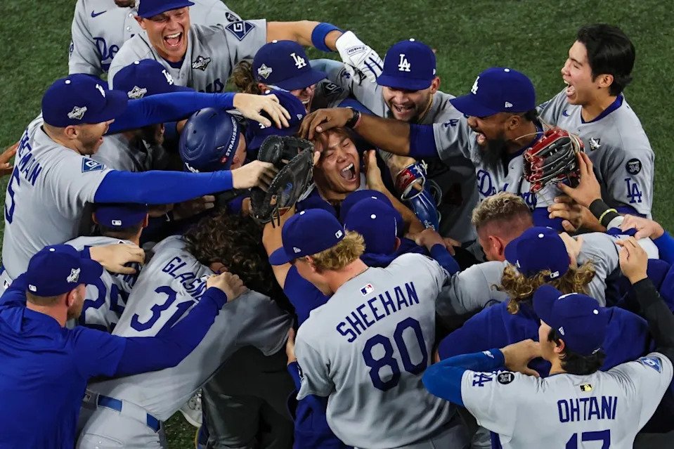 Pitcher Yoshinobu Yamamoto #18 of the LA Dodgers (R) celebrates with teammates after defeating the Toronto Blue Jays, 5-4, in game seven of the 2025 World Series. Getty Images