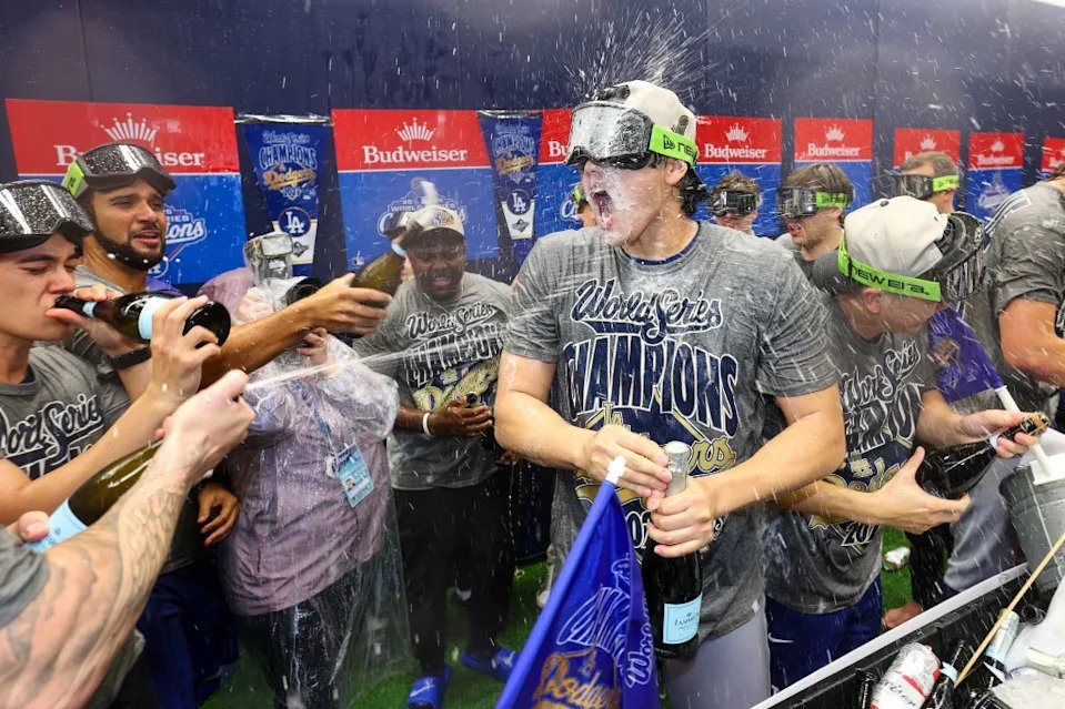 Shohei Ohtani #17 of the LS Dodgers (C) celebrates with teammates in the locker room after defeating the Toronto Blue Jays 5-4 in game seven to win the 2025 World Series. Getty Images