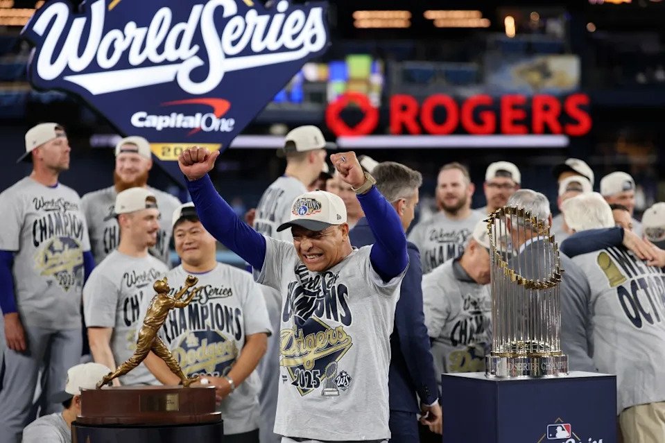 LA Dodgers’ manager Dave Roberts celebrates with his team after defeating the Toronto Blue Jays 5-4 in game seven to win the 2025 World Series. Getty Images