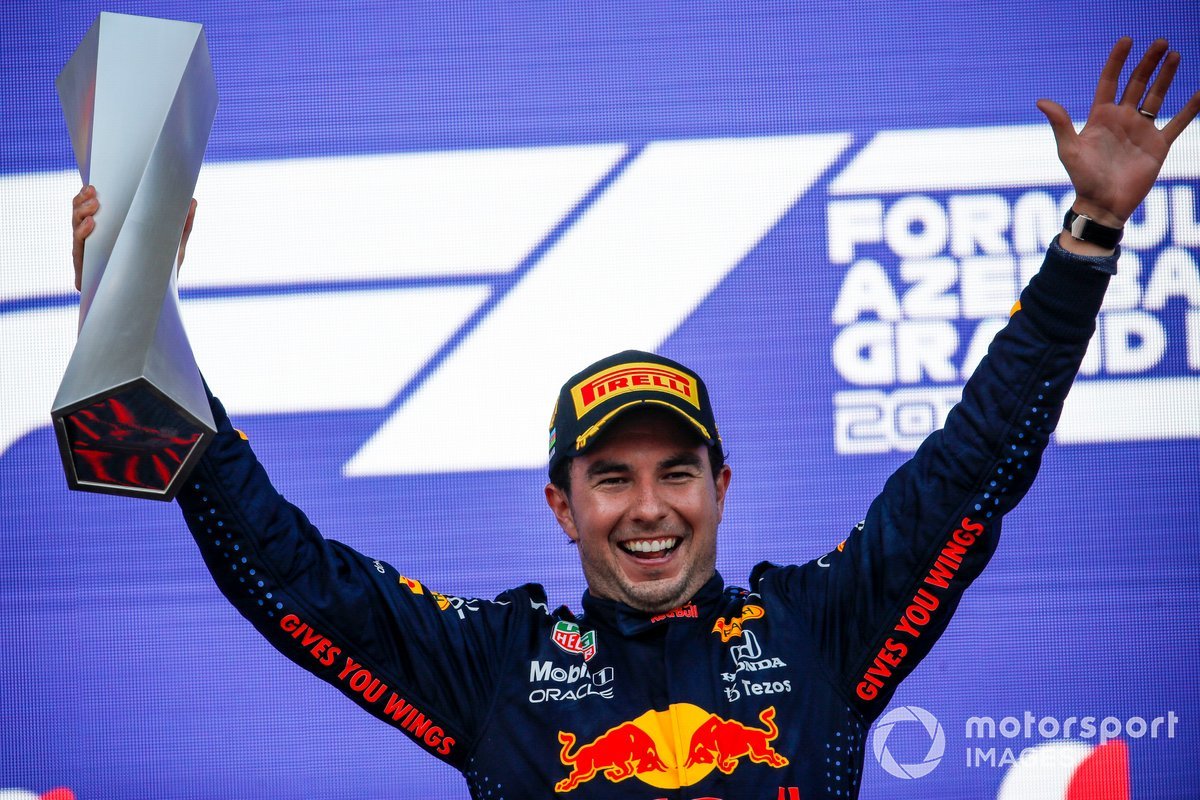 Sergio Perez, Red Bull Racing, 1st position, celebrates on the podium