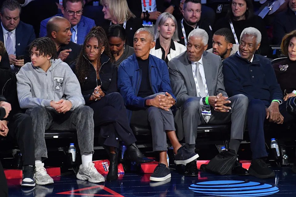 Michelle and Barack Obama sit with Julius Erving and Oscar Robertson while attending the 75th NBA All-Star Game at Intuit Dome on February 15, 2026 in Inglewood, California.
