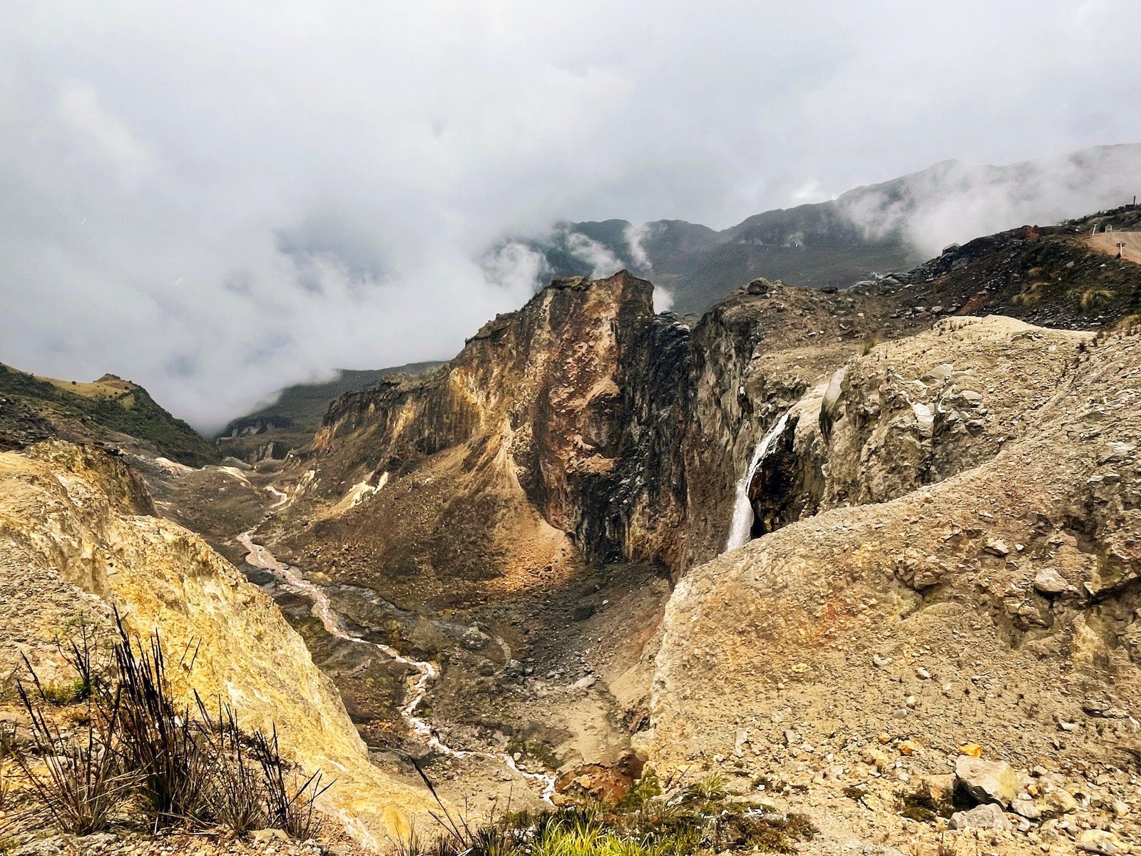 Panorama of the long, sinuous road, shot from a high point, with bare rock in the foreground