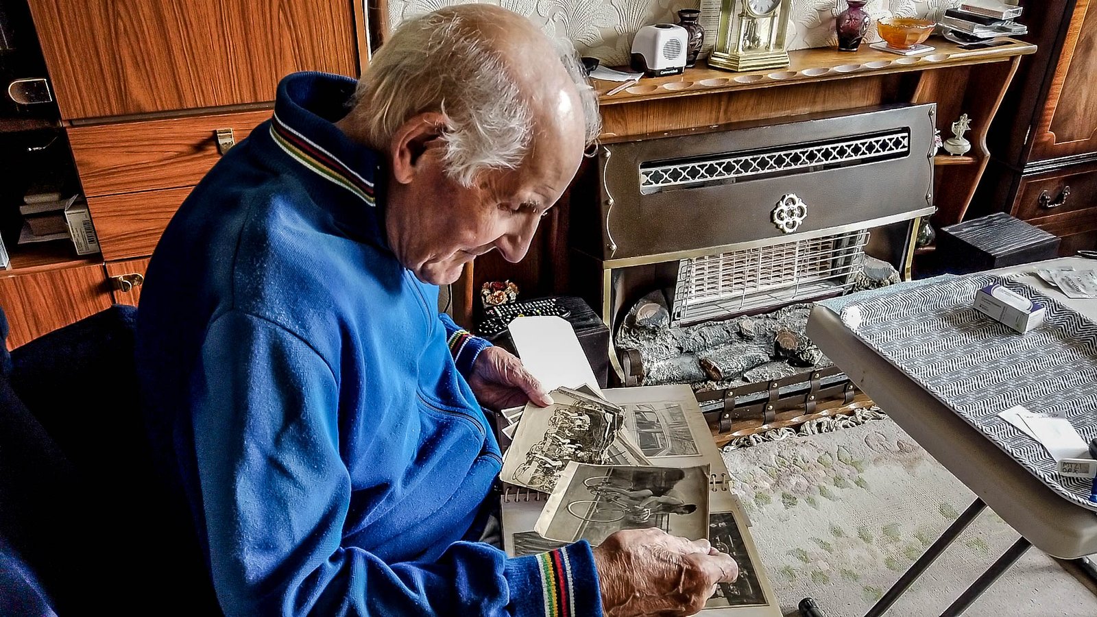 Gerry Shields looking through old photographs