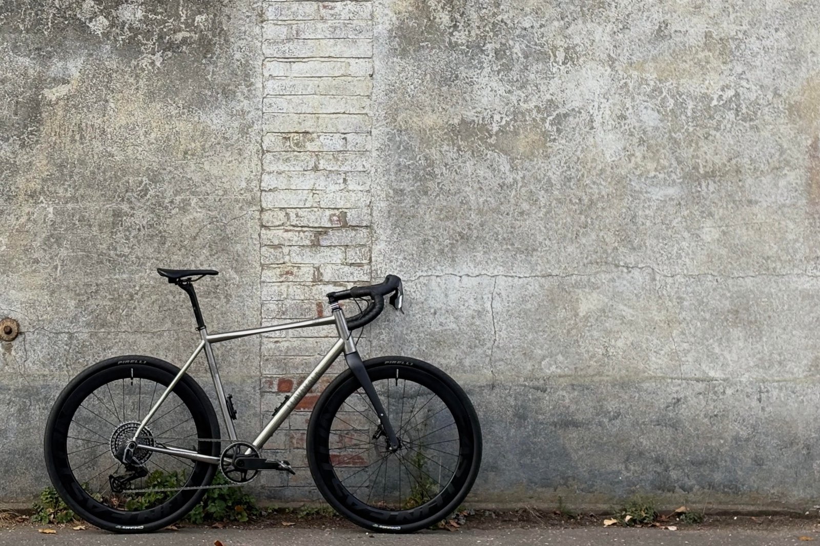Richard Eniffer bike stands up agains a grey wall