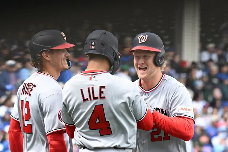 Nationals outfielder Joey Wiemer, right, celebrates a three-run homer against the Cubs that scored teammates Brady House and Daylen Lile. Wiemer recorded six hits in his first six at-bats of the 2026 season.