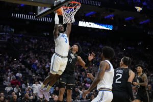 UCLA overcomes broken tooth and stubborn UCF 75-71 to advance in the NCAA Tournament