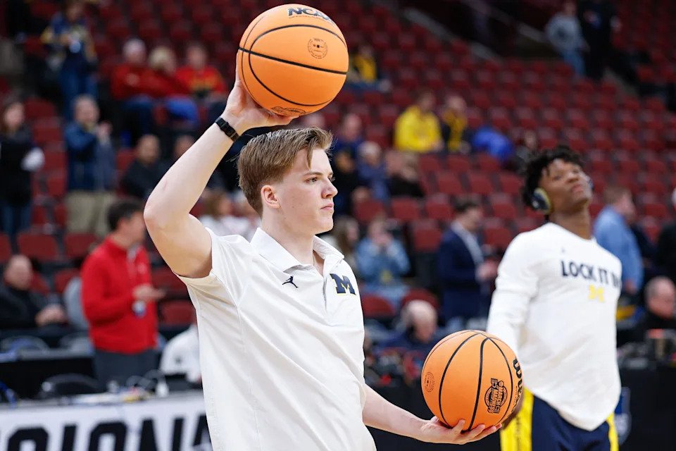 Michigan basketball student manager Eli May, the son of coach Dusty May, helps during warm ups before the Wolverines' Sweet Sixteen game against Alabama on March 27, 2026.