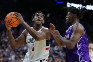 Tarris Reed Jr. has 31 points and 27 rebounds as No. 2 UConn beats Furman 82-71 in NCAA Tournament