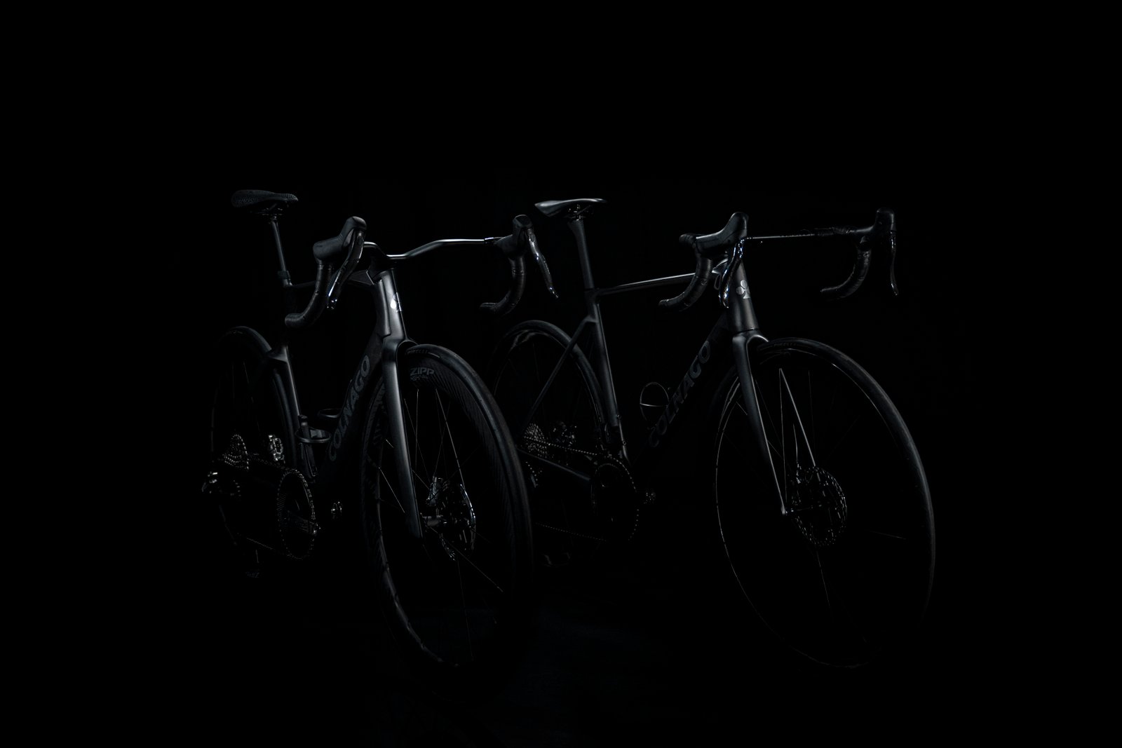 shadowy shots of a black Colnago bike on a black background