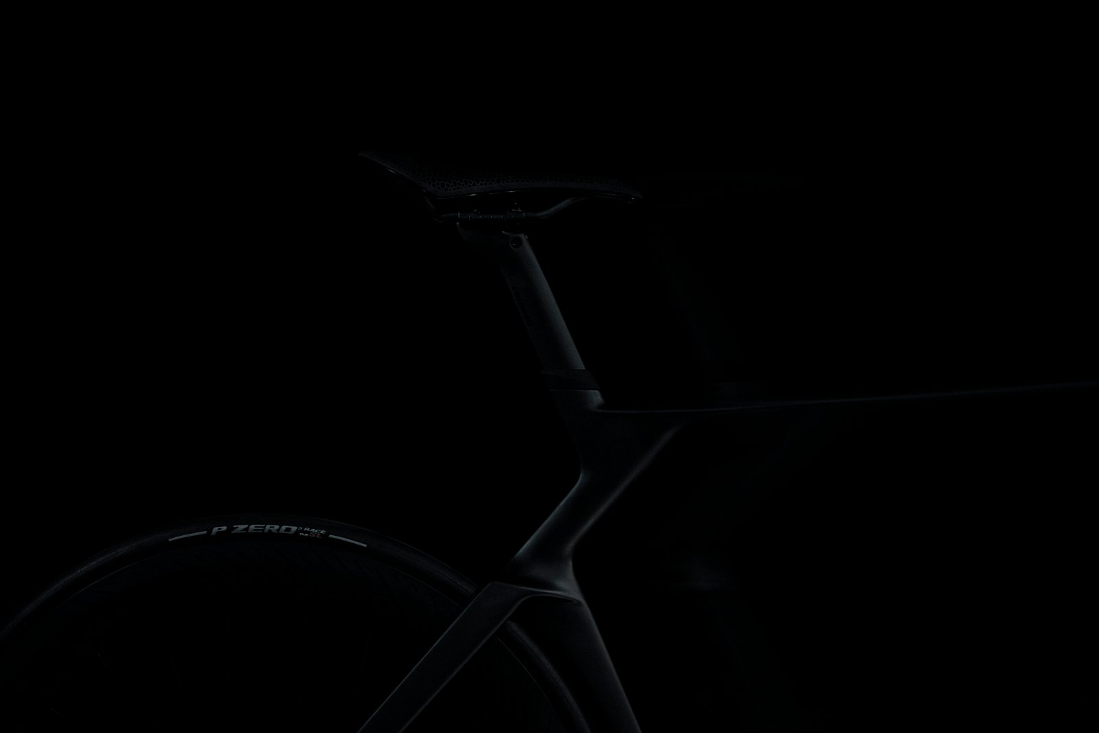 shadowy shots of a black Colnago bike on a black background
