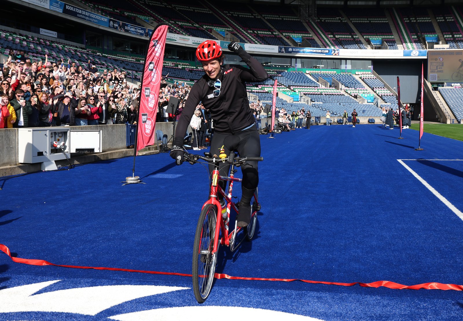 Greg James finishing his tandem challenge