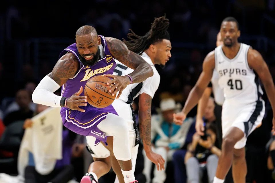 Lakers forward LeBron James starts a fast break against the Spurs.