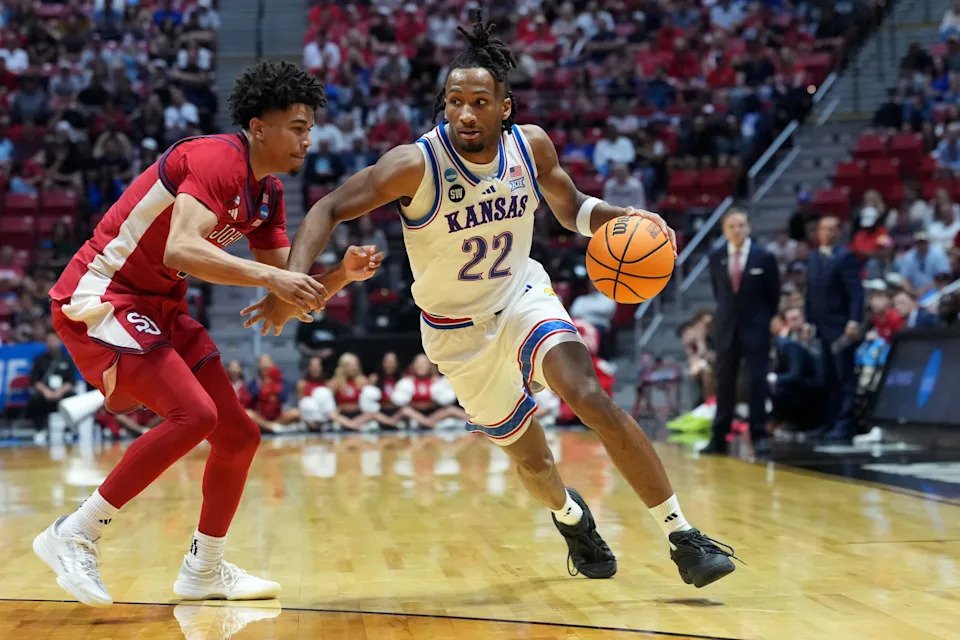 Kansas Jayhawks guard Darryn Peterson (22) controls the ball against St. John's Red Storm guard Oziyah Sellers (4) in the second half during a second round game of the men's 2026 NCAA Tournament at Viejas Arena.