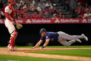 Angels muster only one hit in extra-innings loss to Seattle in home opener