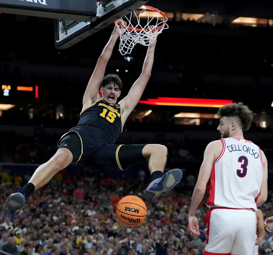 Michigan Wolverines center Aday Mara (15) dunks Saturday, April 4, 2026, during a Final Four game against the Arizona Wildcats at Lucas Oil Stadium in Indianapolis.