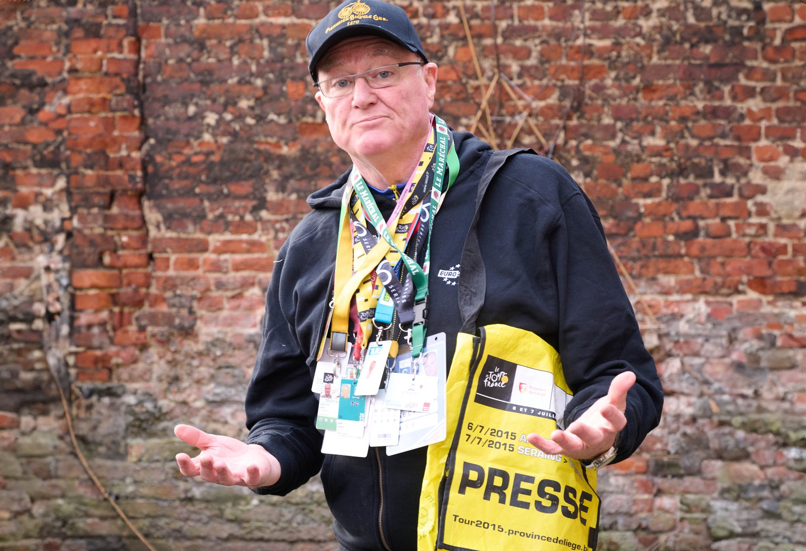 Carlton Kirby sports a few of his press passes