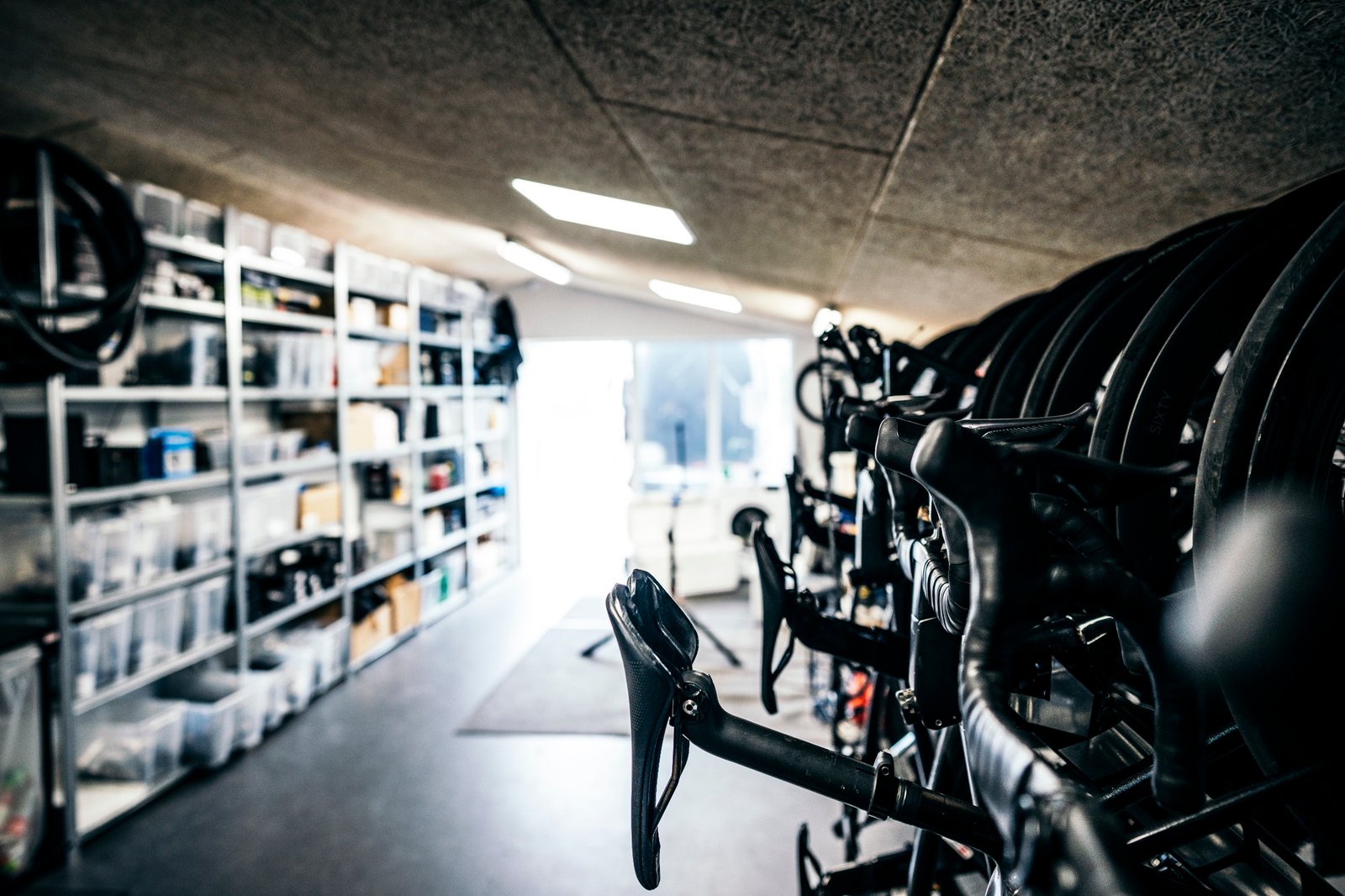 A store room full of hanging bikes