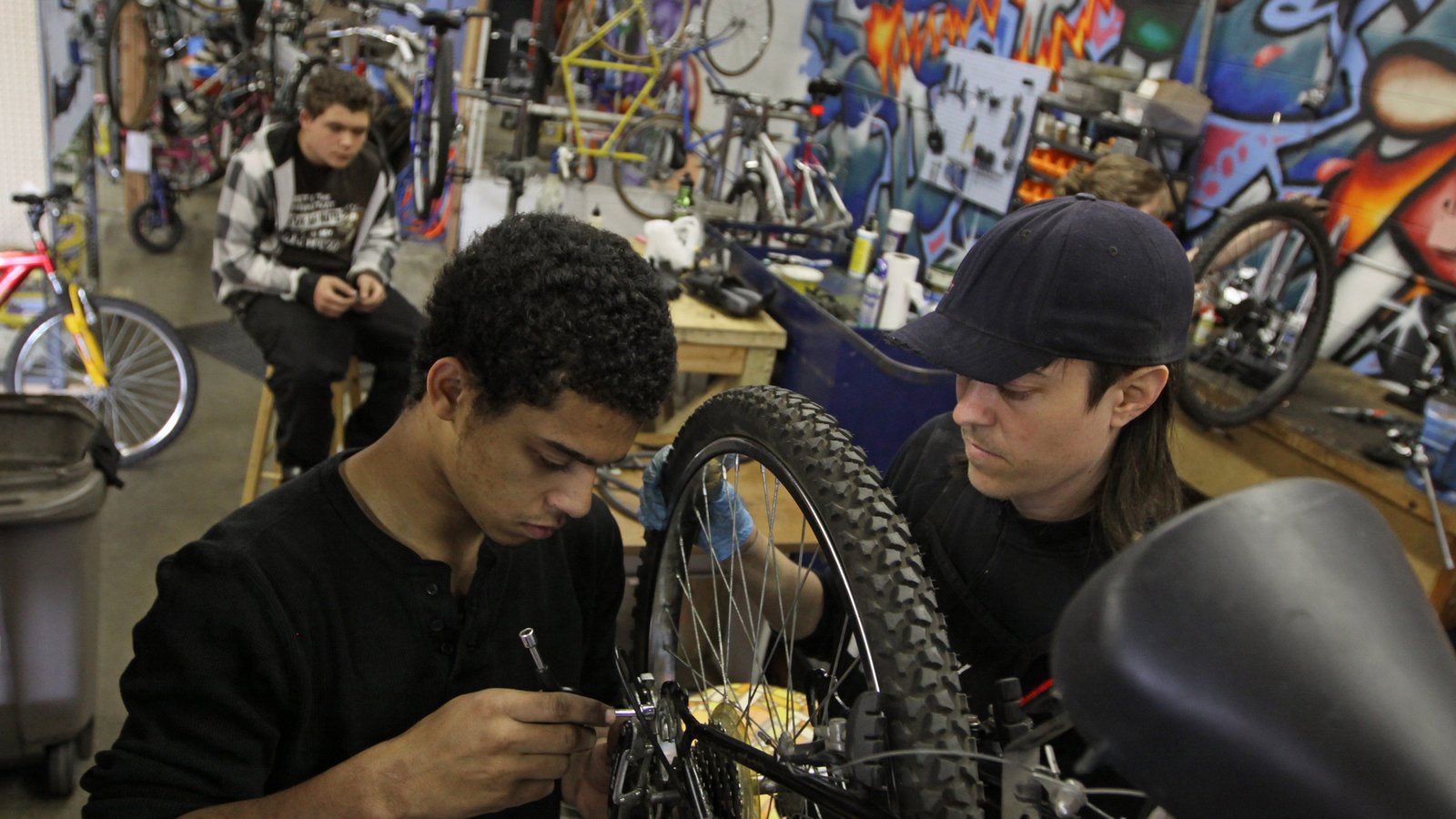 Young people working on a bike