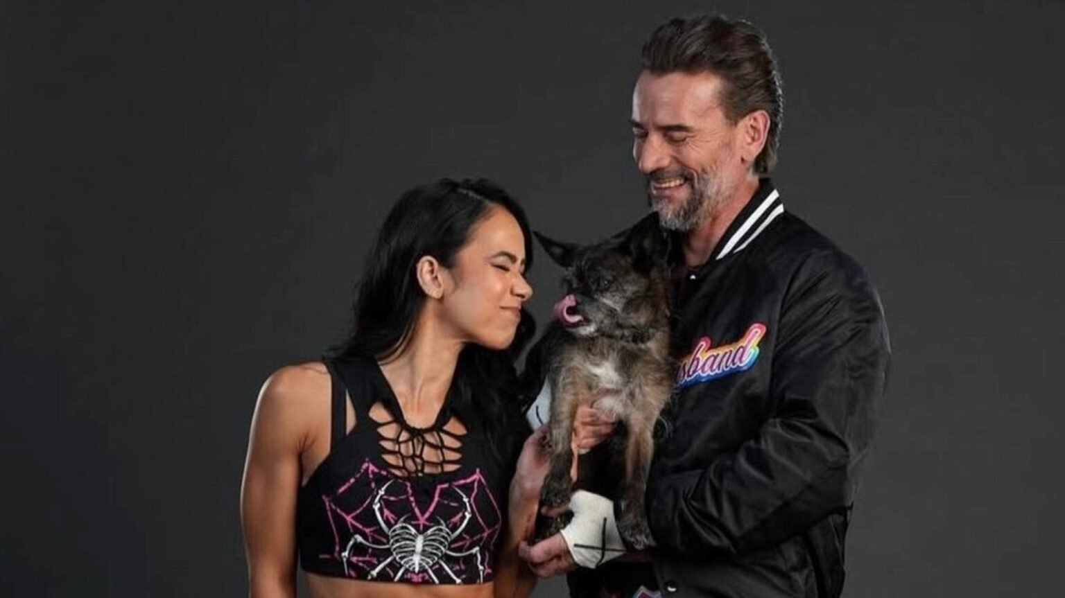 WWE Stars CM Punk & AJ Lee Reflect On Passing Of Their Dog Larry