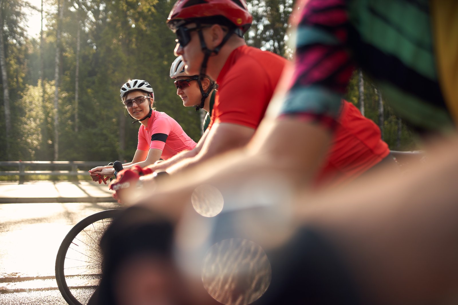 Group of cyclists with female in focus
