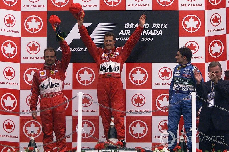 Podium: race winner Michael Schumacher, second place Rubens Barrichello, Ferrari, third place Giancarlo Fisichella, Benetton